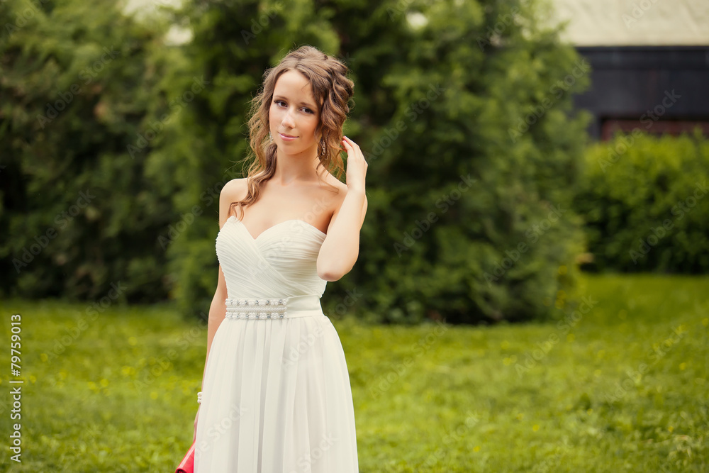 Alluring brown-haired woman outdoors in luxury elegant dress. Ro Alluring brown-haired woman outdoors in luxury elegant dress. Ro