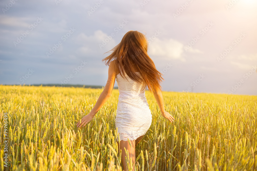 beautiful woman run away in yellow wheat field beautiful woman run away in yellow wheat field