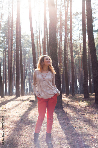 redhead fashionable woman in the forest © ellemarien7