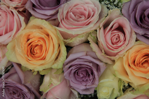 Pastel roses in bridal arrangement