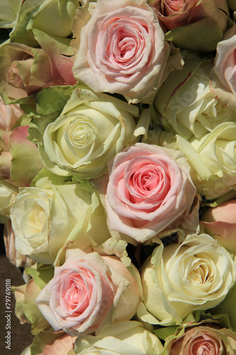 White and Pink roses in wedding arrangement