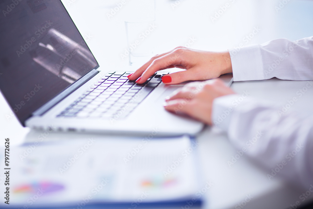 Young businesswoman working on a laptop Young businesswoman working on a laptop