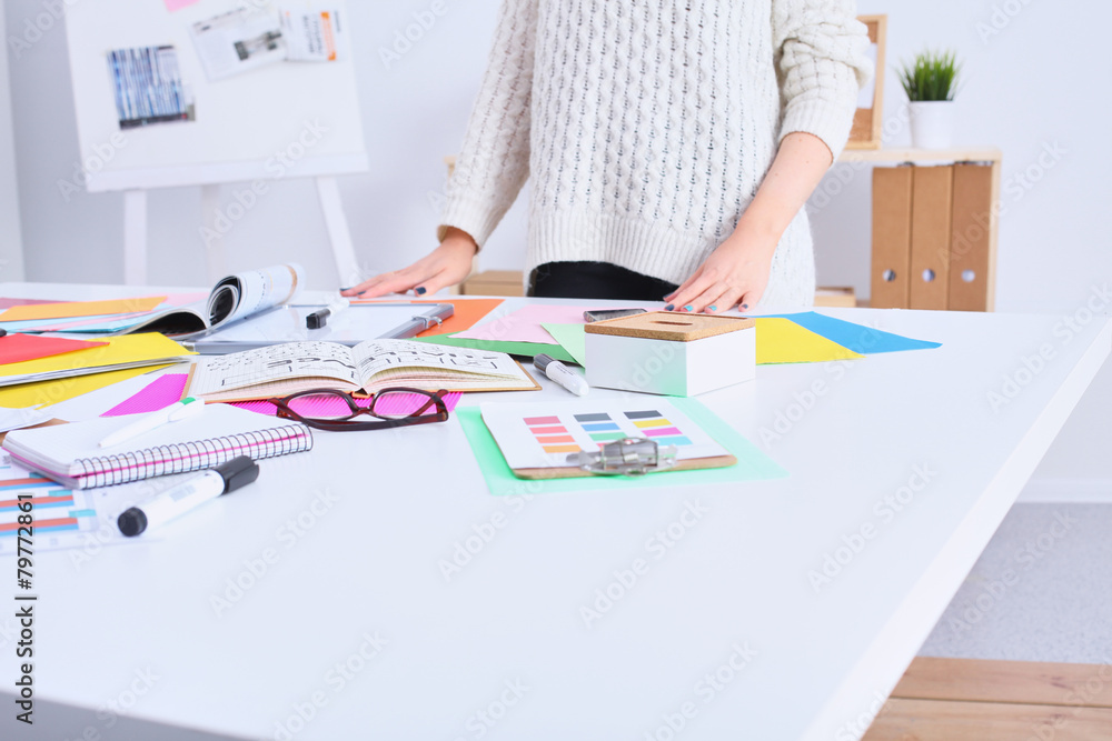 Young female designer standing in office Young female designer standing in office