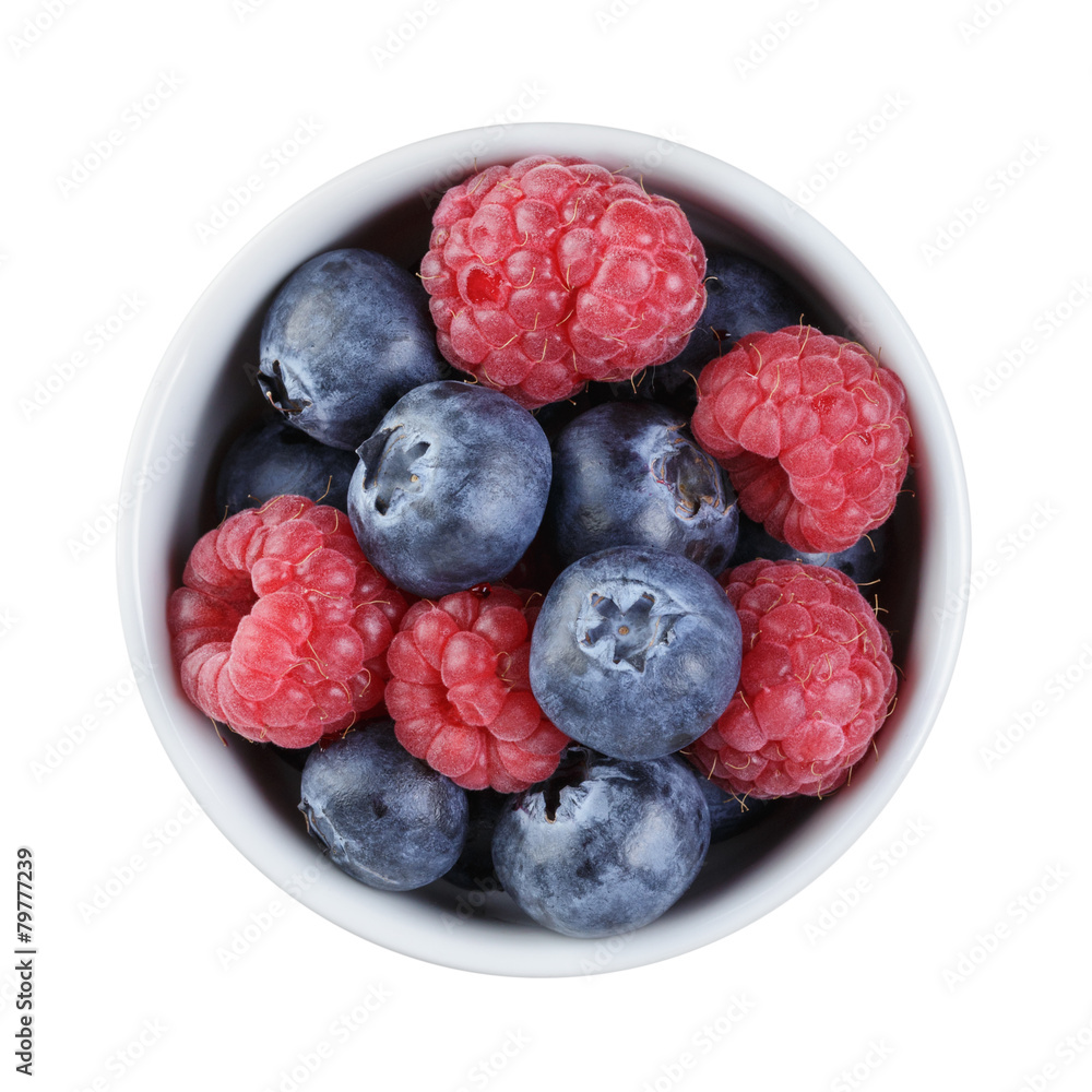 fresh raspberry and blueberry in bowl directly above StockFoto Adobe