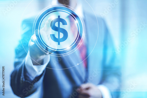 Tablou pe pânză Businessman pointing towards camera selecting dollar