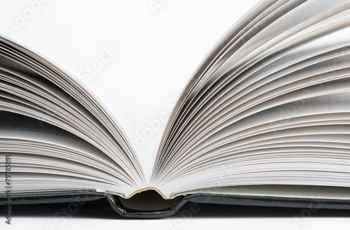 Open book with black hardcover isolated on white.