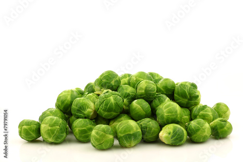 Freshly harvested Brussel sprouts  on a white background photo