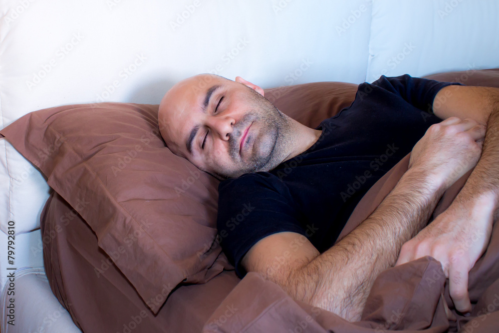 man sleeping on bed man sleeping on bed