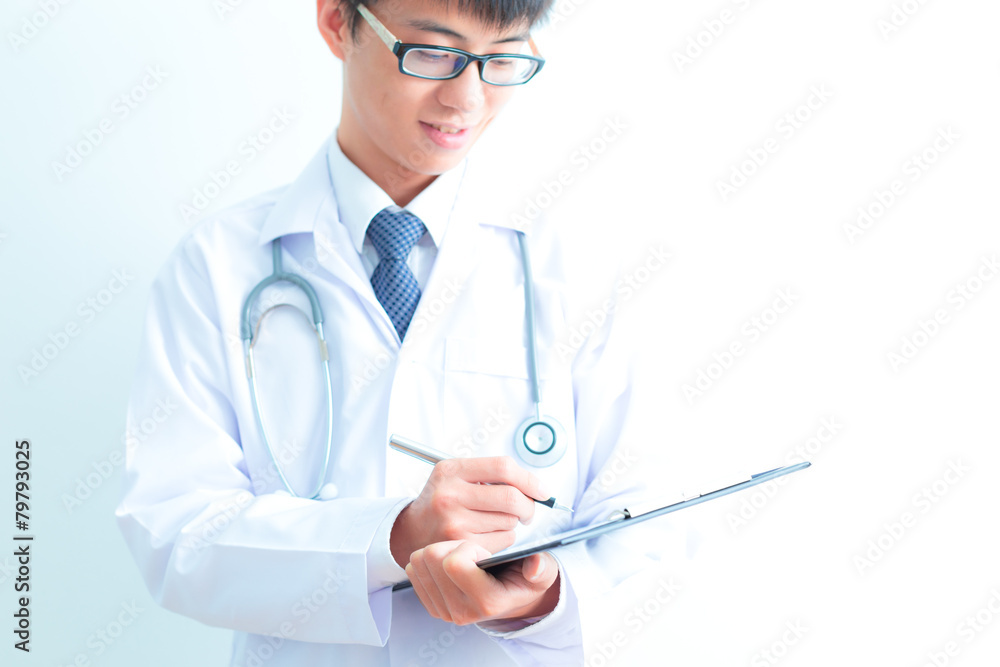 Close-up Of Male Doctor Filling The Medical Form Close-up Of Male Doctor Filling The Medical Form