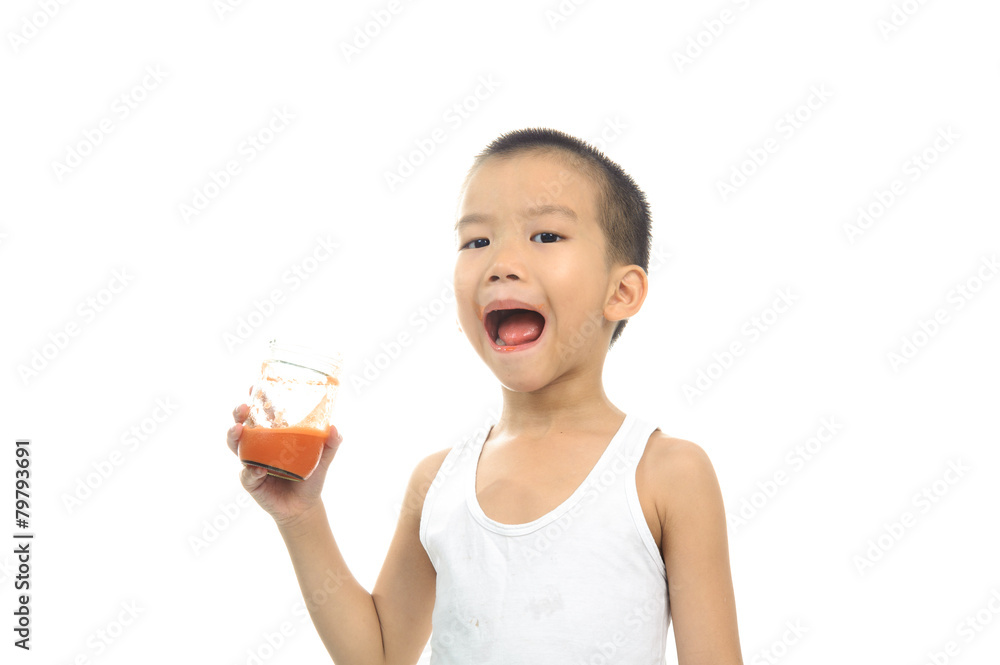 Young boy drink carrot juice Young boy drink carrot juice