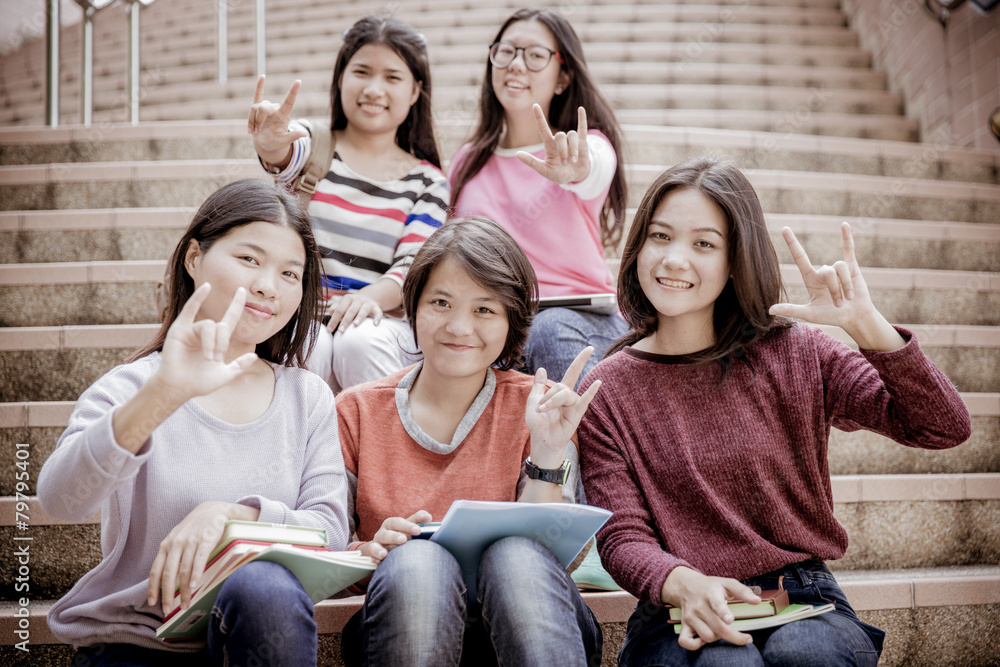 Fototapeta premium group of happy teen high school students outdoors