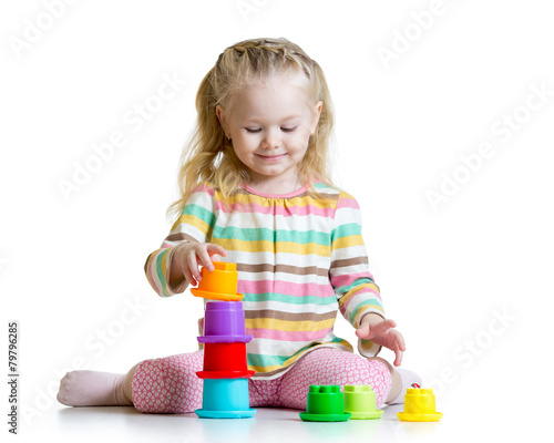 little girl playing with co...