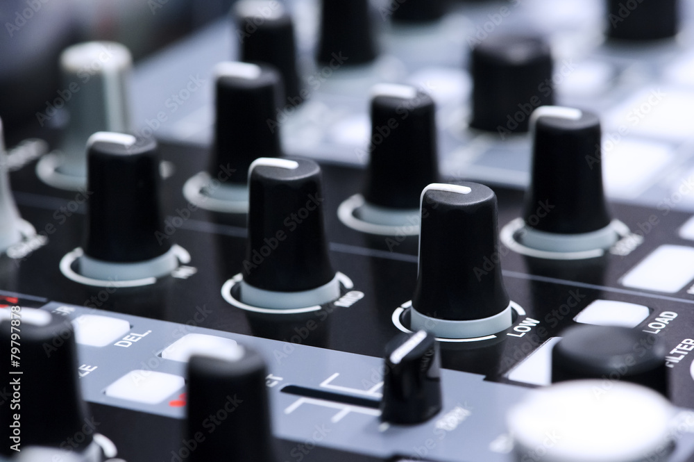 Fader and buttons of DJ mixer controller in nightclub Fader and buttons of DJ mixer controller in nightclub