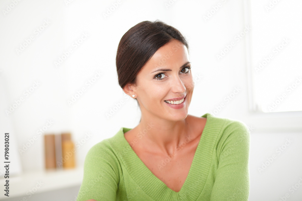 Smart brunette female looking sincerely satisfied Smart brunette female looking sincerely satisfied