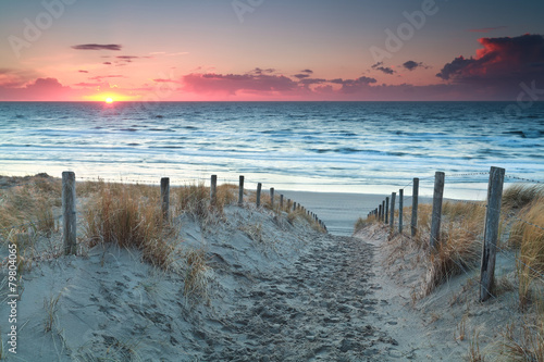 sand path to North sea beach before sunset