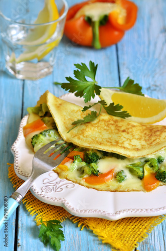 Omelet stuffed with broccoli,cheese and sweet pepper.