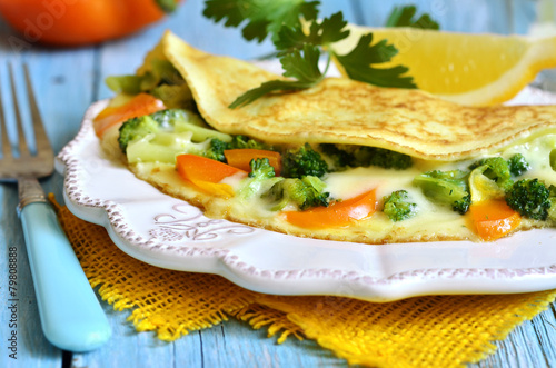 Omelet stuffed with broccoli,cheese and sweet pepper.