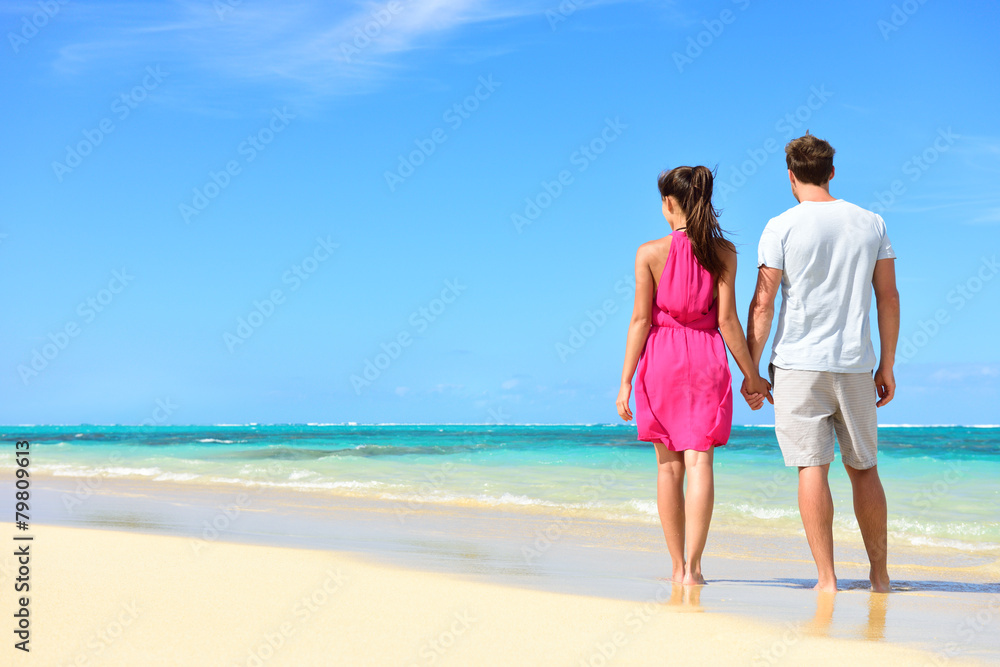 Summer holiday - couple on tropical beach vacation Summer holiday - couple on tropical beach vacation