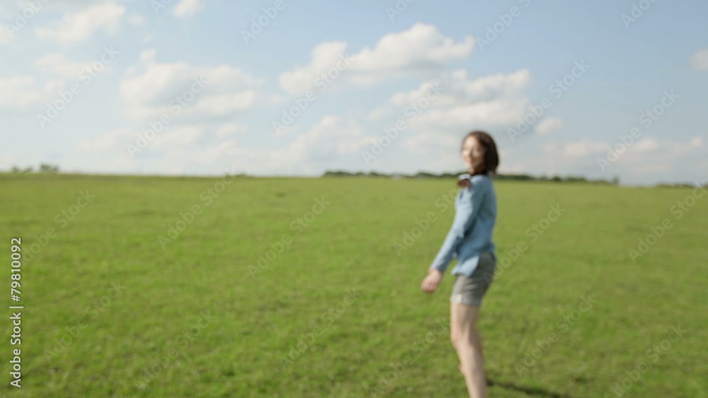 The girl runs barefoot through the field The girl runs barefoot through the field