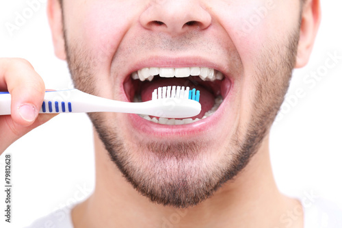Man with toothbrush isolate...