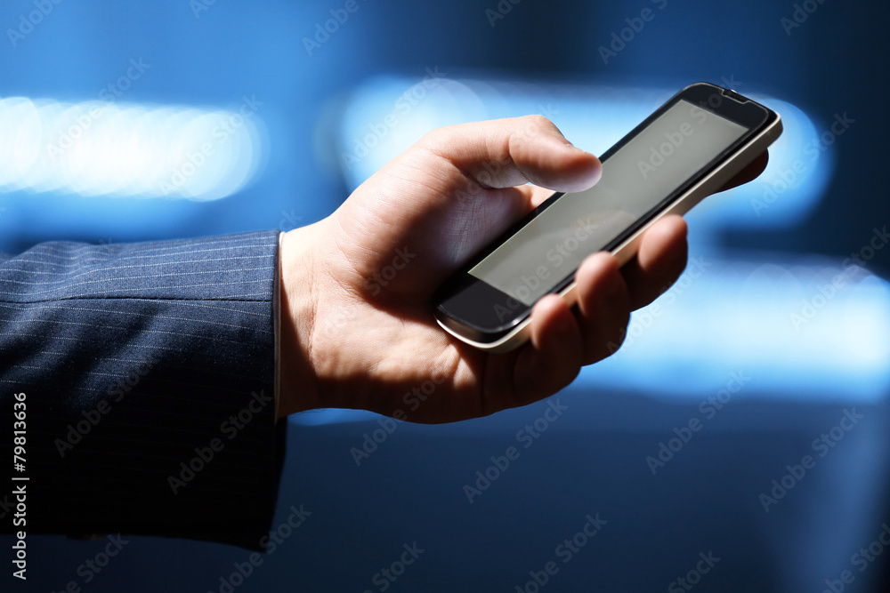 Male hand touching screen phone close-up