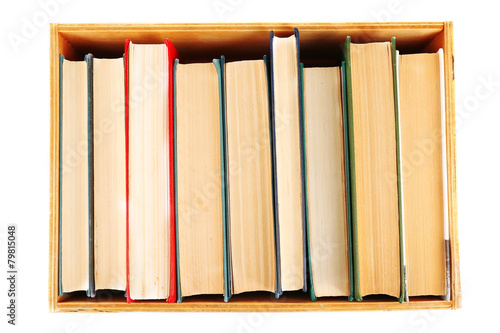 Books in wooden box, top view