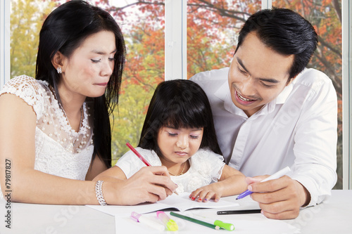 Modern family doing homework on table