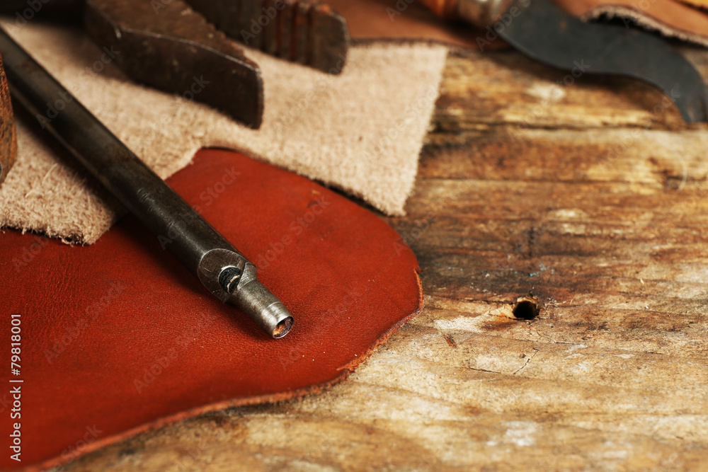 Leather and craft tools on table close up