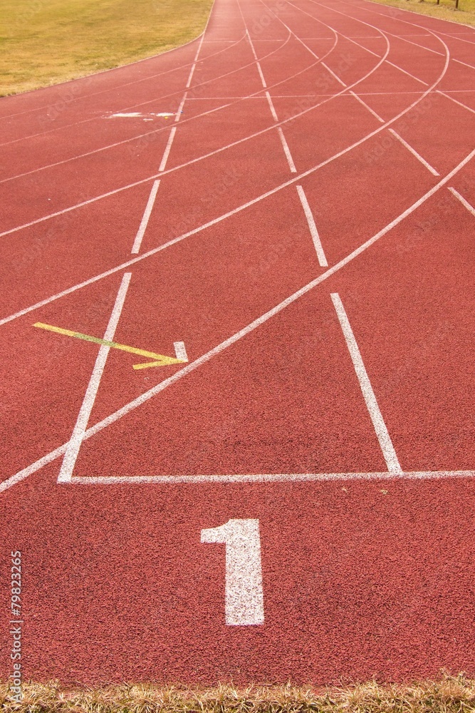 White lines and texture of running racetrack, red racetrack