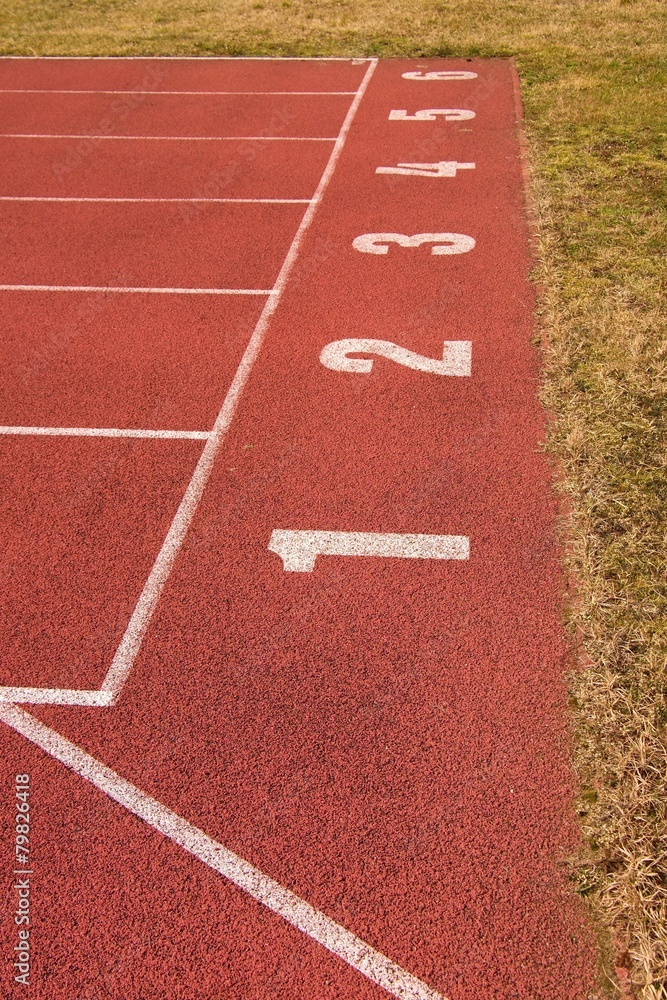 White number on red rubber racetrack running stadium
