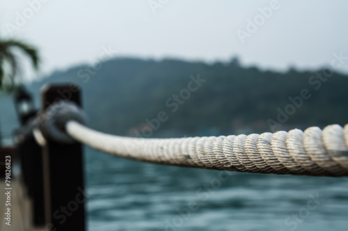 White rope tied into a knot.