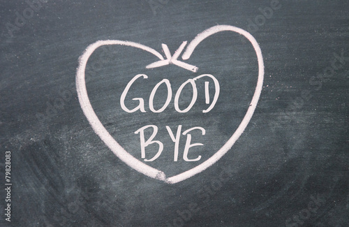 good bye text and heart sign on blackboard photo