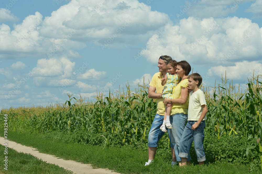 Family standing in field