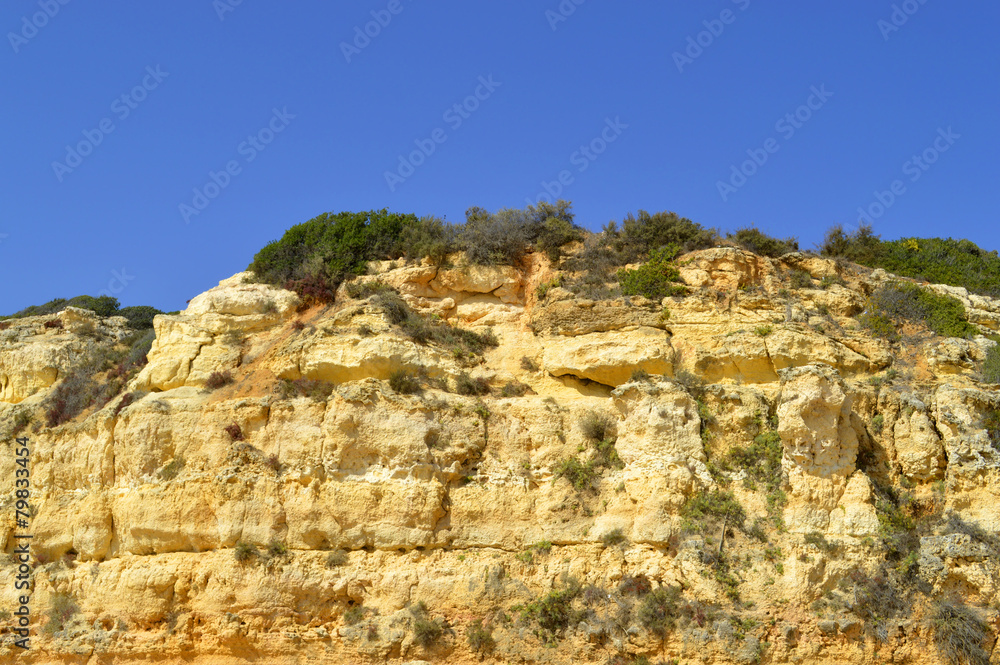 Spectacular cliffs on Senhora Da Rocha Nova Beach in Portugal