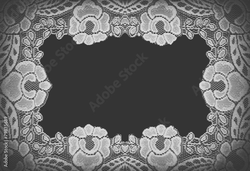 Handmade lace doily on a black background