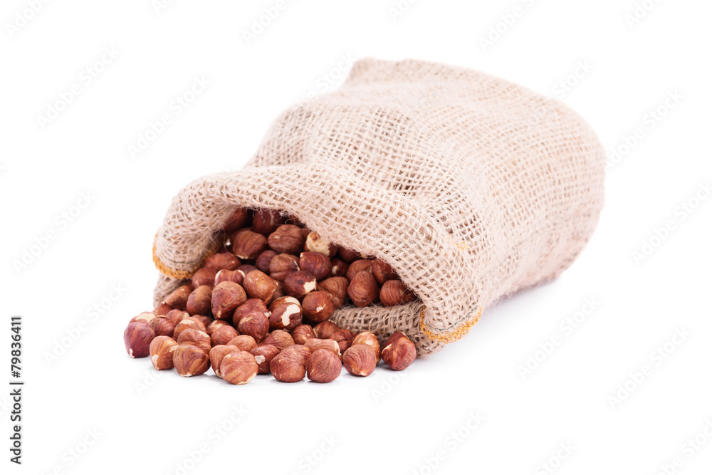 Spilled sack of hazelnuts