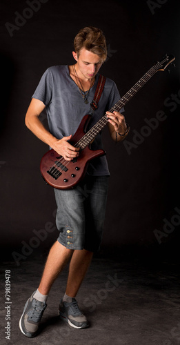 Bass guitarist. © indigolotos