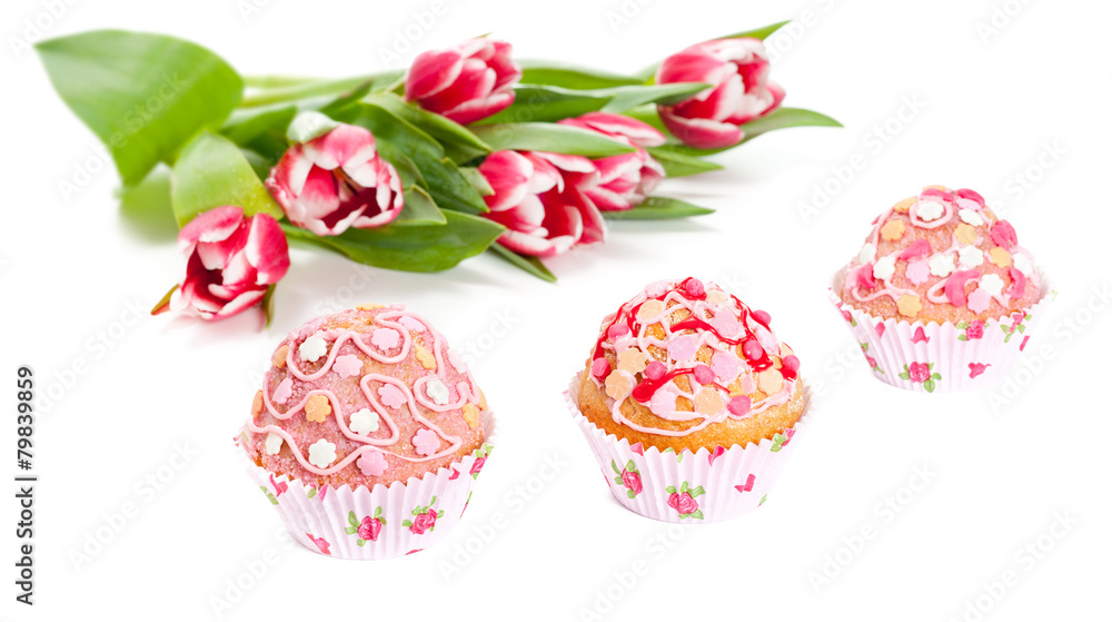 Cupcakes and tulips isolated on white Cupcakes and tulips isolated on white
