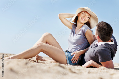 happy people are relaxing on a beach