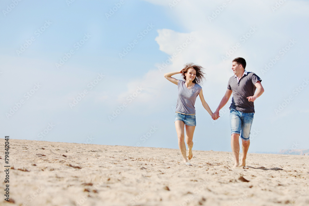 happy people are relaxing on a beach happy people are relaxing on a beach