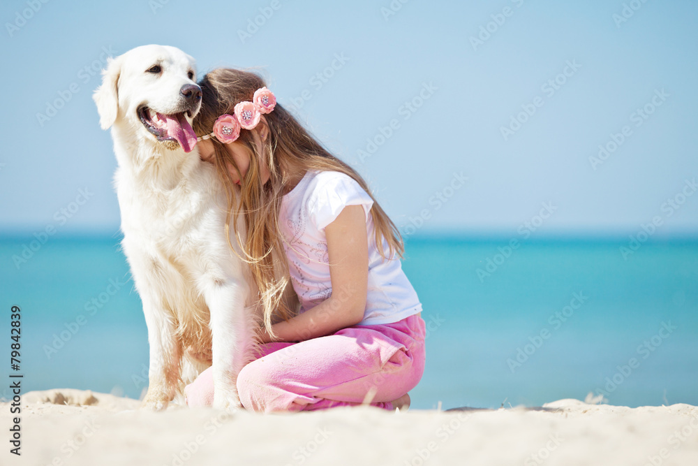 Girl are playing with her don on a beach Girl are playing with her don on a beach
