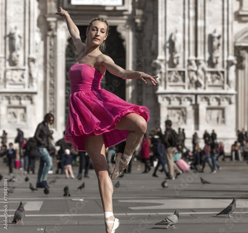 Classical dancer wearing pink dress and performing in Milan