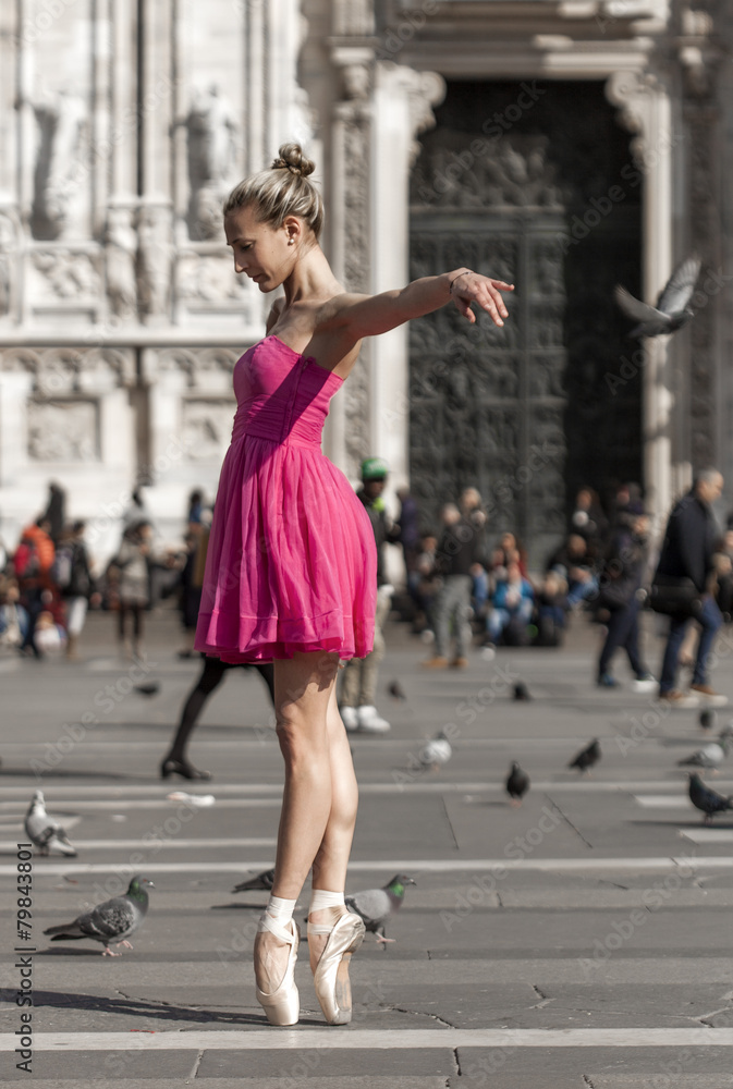 Girl dancing near Milan Cathedral Square