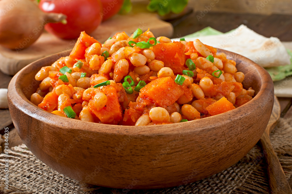 Stewed white beans and sliced pumpkin in tomato sauce Stewed white beans and sliced pumpkin in tomato sauce