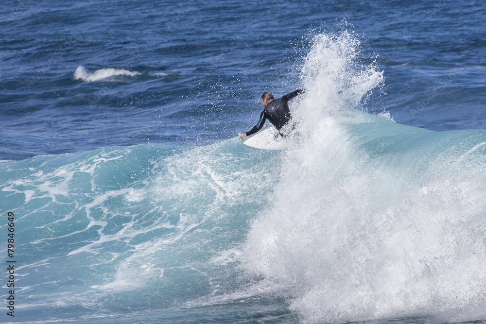 Extreme surfer riding giant ocean wave in Hawaii Extreme surfer riding giant ocean wave in Hawaii