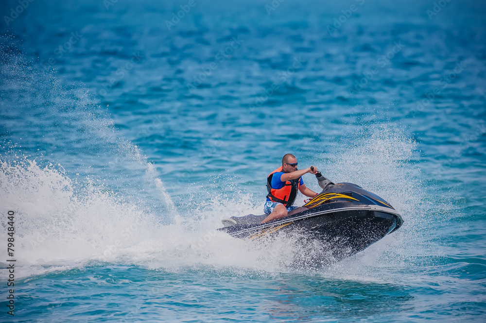 Fototapeta premium Young Man on Jet Ski, Tropical Ocean, Vacation Concept