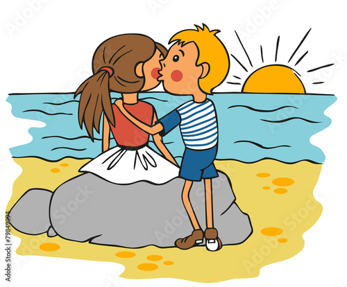 boy kissing girl on cheek at sunset