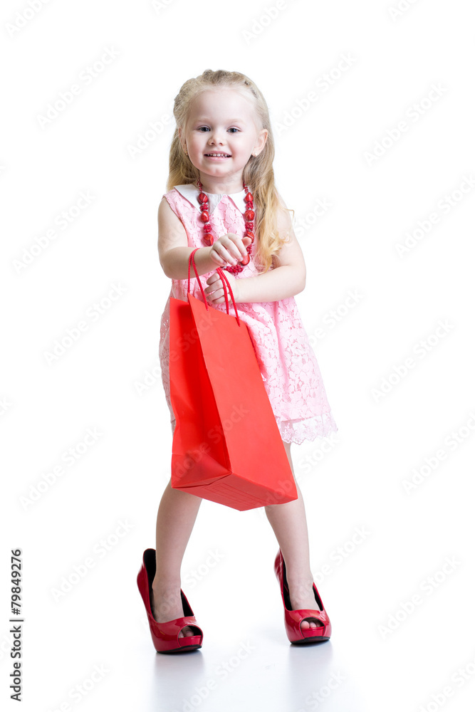 little girl in mother shoes on a white background little girl in mother shoes on a white background