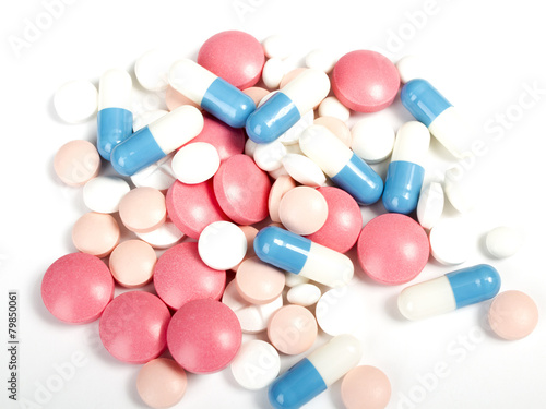 pills and capsules on white background