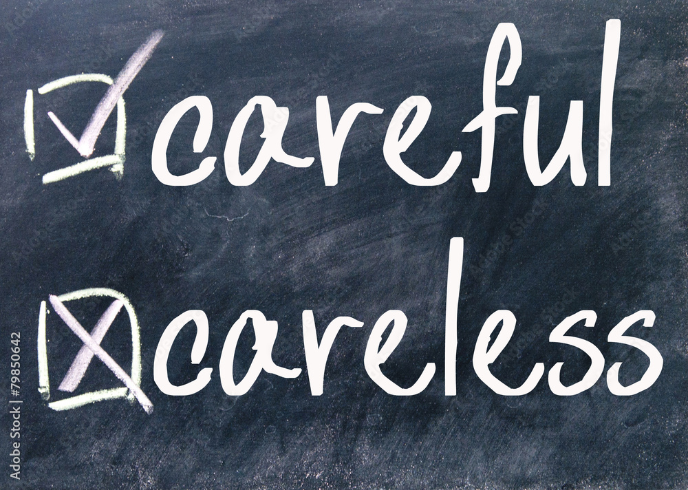 Fototapeta premium careful and careless sign on blackboard